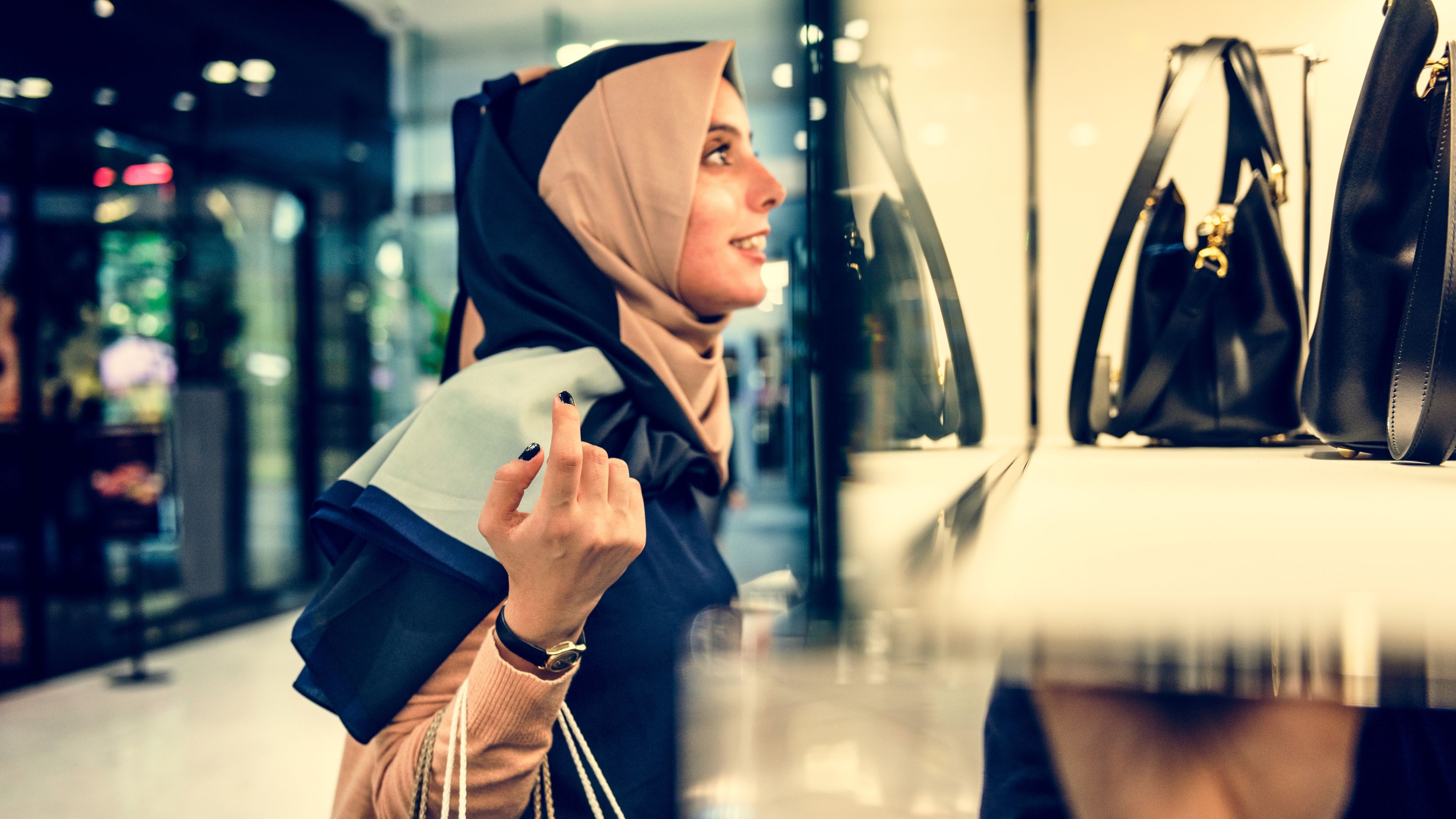 Young woman is shopping dresses