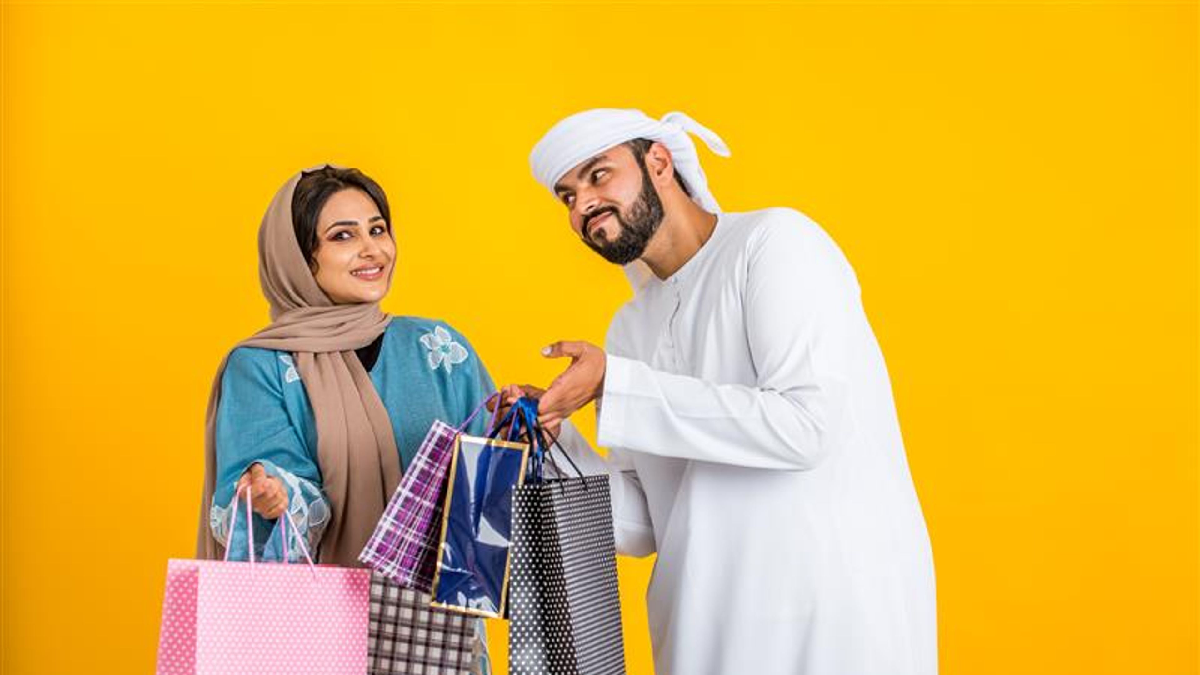 A couple with some shopping bags 