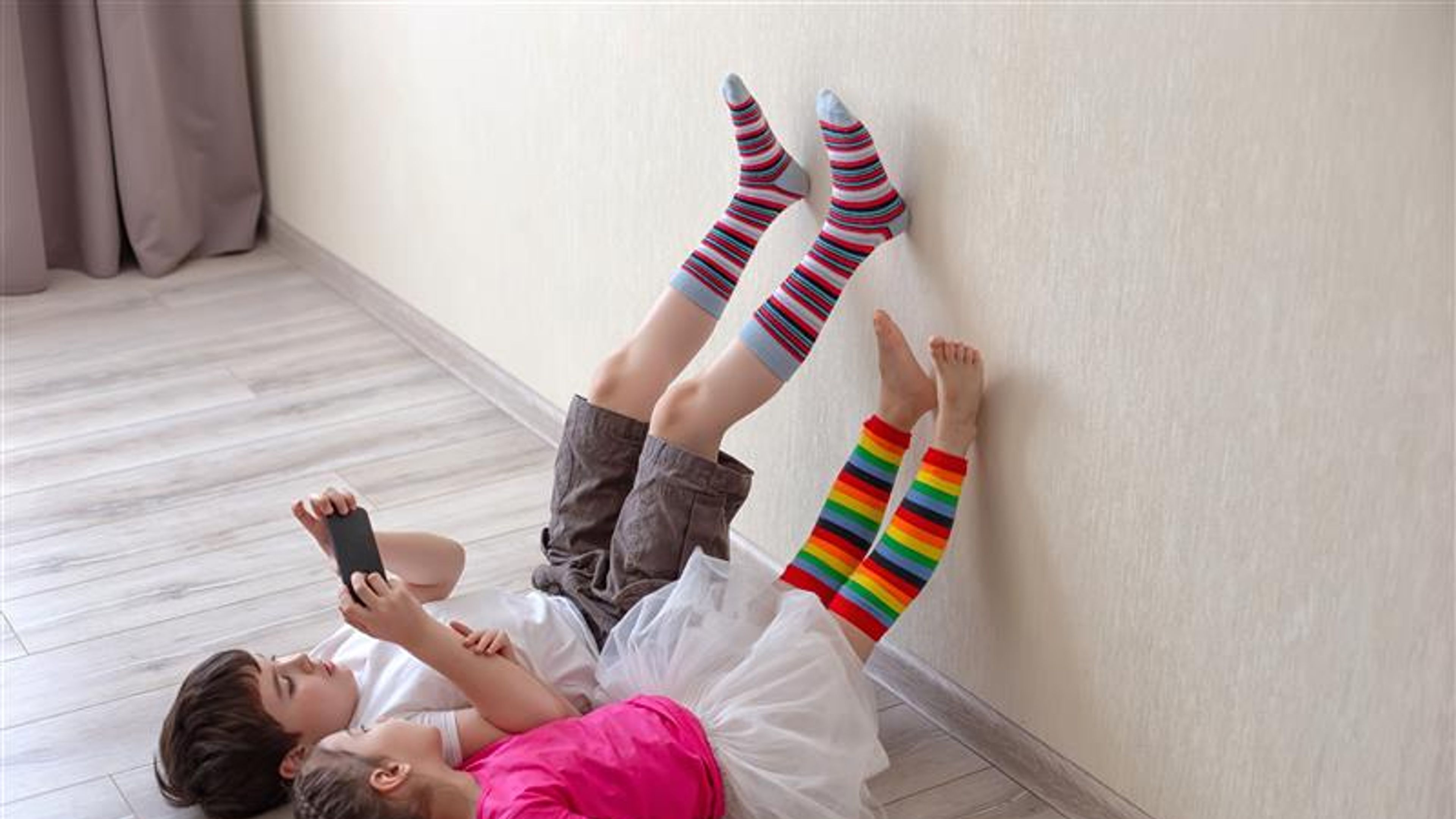 Boy and girl children in socks